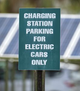 Public EV charging stalls at Vancouver retail centre with clear wayfinding